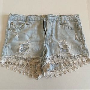 Light washed crochet trimmed jean shorts.